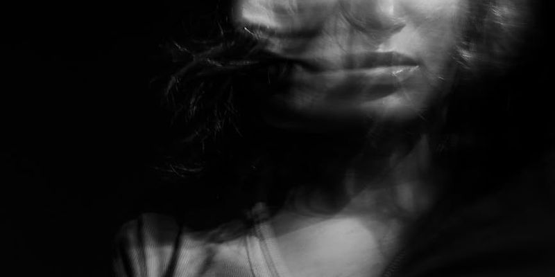 Motion blur of a person moving in the studio.